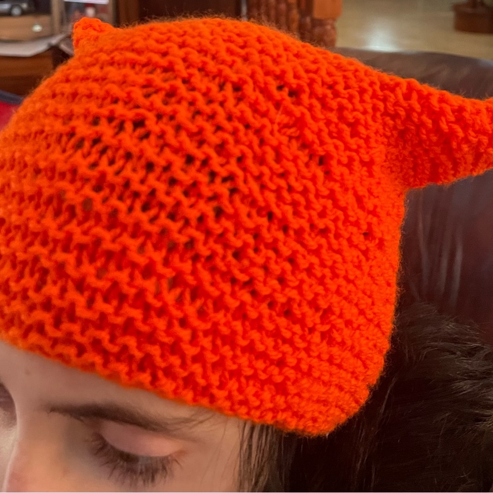 New orange hand crafted crocheted hat.